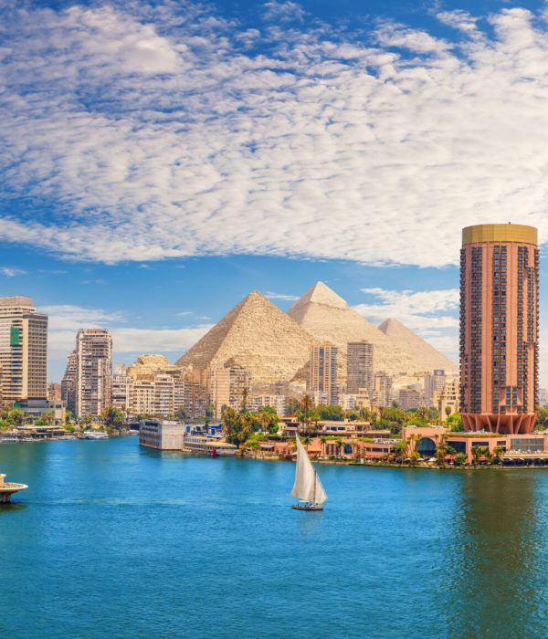 View,On,The,Nile,,Cairo,City,And,Famous,Pyramids,In